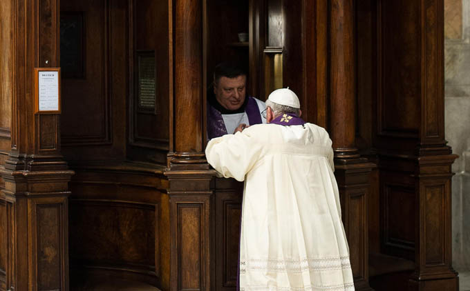 A clergyman hears confession from Pope Francis during a penitential liturgy in St. Peter's Basilica at the Vatican March 28. Pope Francis surprised his liturgical adviser by going to confession during the service. (CNS photo/L'Osservatore Romano via Reuters)