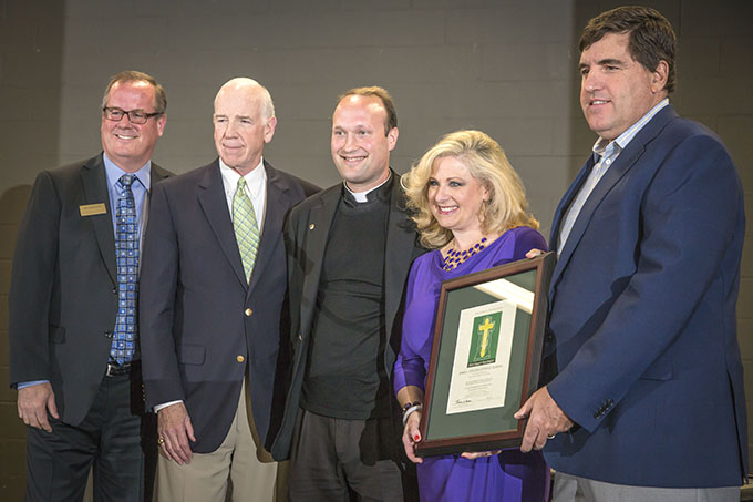 Matt Kramer, left, president and CEO of The Catholic Foundation, Trustee Joe Murphy with Fr. Jason Cargo of Immaculate Conception Catholic Church in Corsicana, and Principal Renee Ozier of James L. Collins Catholic School in Corsicana and John Landon, distribution chairman at the Catholic Foundation's 2014 Grant Ceremony at San Juan Diego Catholic Church in Dallas on April 30. (RON HEFLIN/Special Contributor)