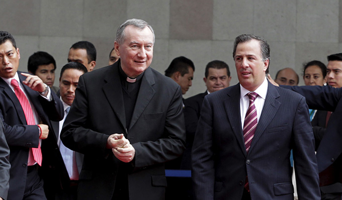 Mexican Foreign Minister Jose Antonio Meade Kuribrena walks with Cardinal Pietro Parolin, Vatican secretary of state,   in Mexico City July 13. Cardinal Parolin traveled to Mexico to discuss the flow of child migrants from Central America with regional counterparts. (CNS photo/courtesy of SRE)