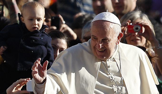 Pope Francis greets the crowd during his general audience in St. Peter's Square at the Vatican Nov. 19. (CNS Photo)