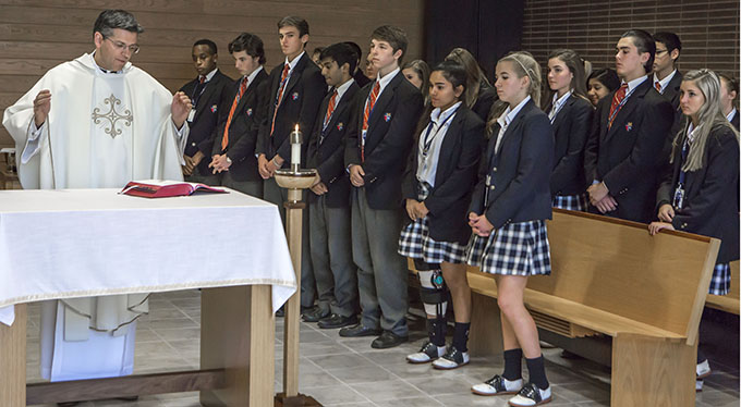 Father Alfonse Nazzaro celebrates Mass at John Paul II   High School in Plano on Jan. 8. (RON HEFLIN/Special Contributor)