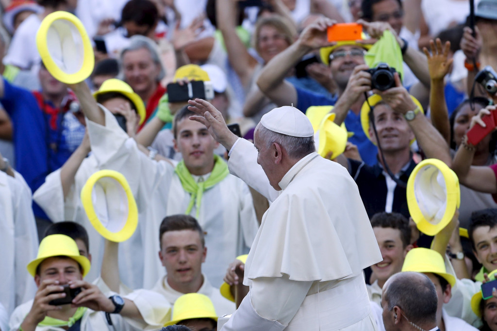 Pope Francis waves as he arrives to attend an audience with some 9,000 altar servers in St. Peter's Square at the Vatican Aug. 4. (CNS photo/Giampiero Sposito, Reuters) 