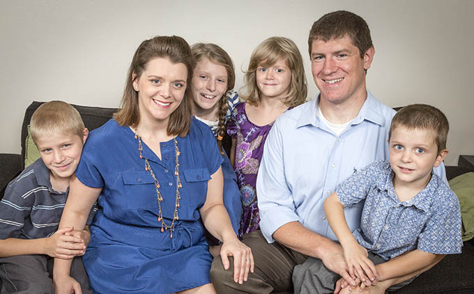 Elisa and Steve Lowe pose with their children, from left, Robert, 9, Johanna, 11, John Paul, 4, and Claire, 7, at their home in Farmers Branch on July 29. (RON HEFLIN/Special Contributor)