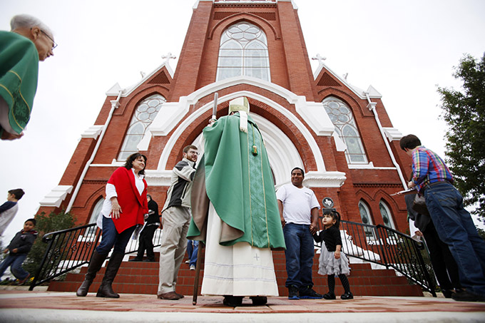 Bishop Kevin J. Farrell greets parishioners outside of St. Patrick Catholic Church, following a Mass celebrating completion of the parish’s 2nd Century Restoration project on Oct. 25 in Denison. (Ben Torres/Special Contributor)