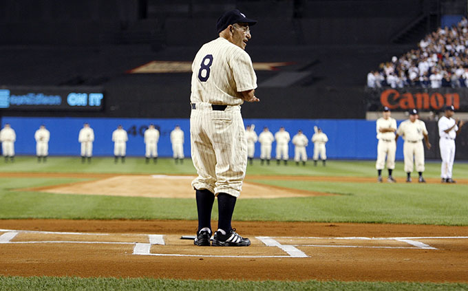 Former New York Yankee Yogi Berra stands at home plate before the final regular season MLB American League baseball game at Yankee Stadium in New York, in this file photo taken September 21, 2008. Berra, a Hall of Fame catcher for the New York Yankees whose mangled syntax made him one of the sports world's most beloved and frequently quoted figures, died on Sept. 22 at the age of 90, Major League Baseball said. (REUTERS/Mike Segar/Files)