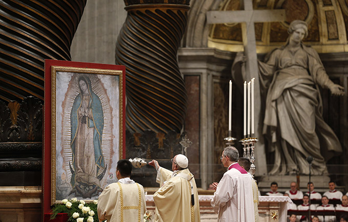 Pope Francis uses incense to venerate an image of Our Lady of Guadalupe during Mass marking the feast of Our Lady of Guadalupe in St. Peter's Basilica at the Vatican Dec. 12. (CNS photo/Paul Haring)
