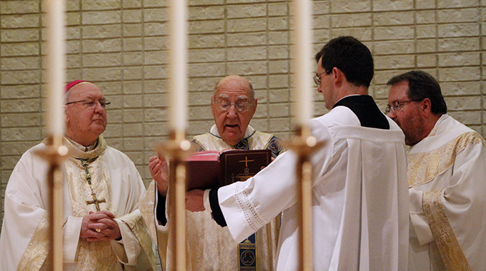 Bishop Kevin J. Farrell, left, concelebrates Mass with Msgr. Thomas Weinzapfel during a celebration of Msgr. Weinzapfel's 70th anniversary of Ordination, on Dec. 23, at St. Pius X Catholic Church in Dallas. Msgr. Weinzapfel died Jan. 1 of injuries suffered in a fall on Christmas Day. (Ben Torres/Special Contributor)