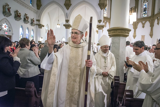 Bishop Gregory Kelly walks up and down the aisles of the Cathedral Shrine of the Virgin of Guadalupe, offering blessings to the congregation during his Episcopal Ordination Mass on Feb. 11. (RON HEFLIN/Special Contributor)