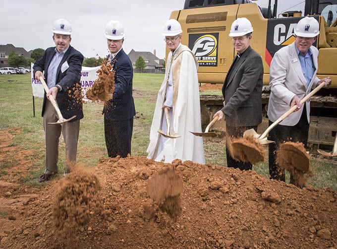From left, Bob Poynor, chair of the building committee; Brian Loughmiller, mayor of McKinney; Auxiliary Bishop Greg Kelly; Father Don Zeiler, pastor at St. Gabriel; and Deacon Mike Seibold during the groundbreaking ceremony at St. Gabriel the Archangel Catholic Church in McKinney on May 15. (RON HEFLIN/Special Contributor)