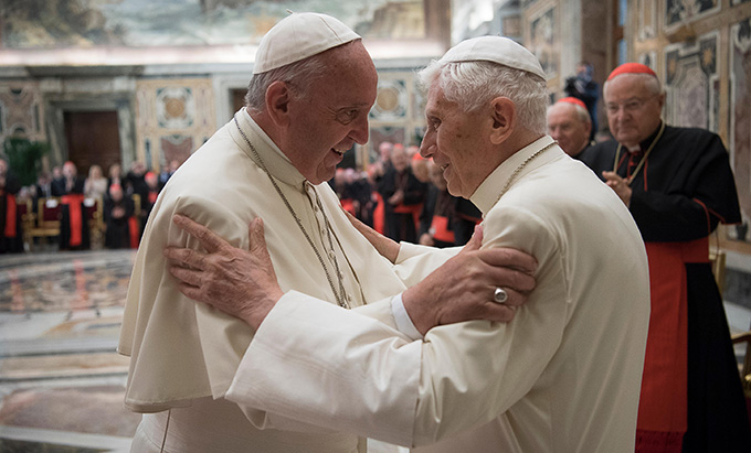 Pope Francis greets retired Pope Benedict XVI during a June 28 ceremony at the Vatican marking the 65th anniversary of the retired pope's priestly ordination. (CNS photo/L'Osservatore Romano, handout) 