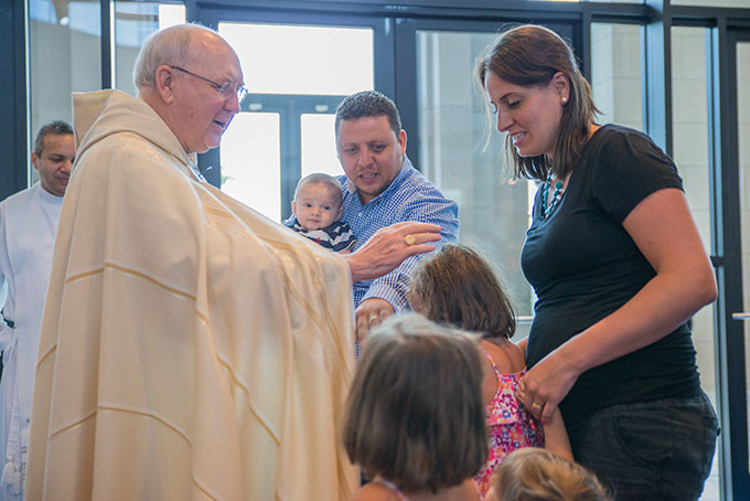 Bishop Kevin J. Farrell offers a blessing to Deborah Solorzan after a special ceremony of those attending World Youth Day in Poland held at Nuestra Señora Del Pilar Catholic Church in Dallas on June 24. (ZACHARY HARRIS/Special Contributor)