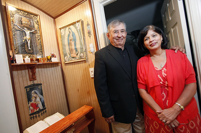 BEN TORRES/Special Contributor Carlos and Yolanda Liscano, parishioners at St. Francis of Assisi Catholic Church, at their home on Aug. 28. (BEN TORRES/Special Contributor)