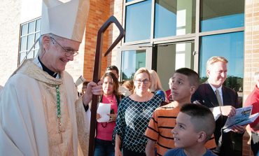 Awaiting a new bishop, familiar face offers guidance