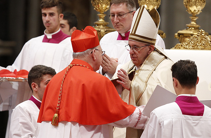 Pope Francis greets new Cardinal Kevin J. Farrell, prefect of the new Vatican office for laity, family and life, during a consistory in St. Peter's Basilica at the Vatican Nov. 19. The pope created 17 new cardinals.(CNS photo/Paul Haring) 