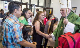 Bishop helps parish, school mark pair of milestones