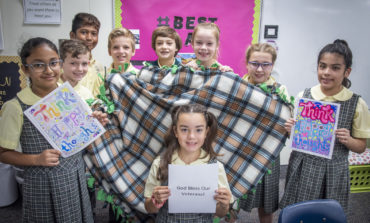 Students work together to make blankets for veterans